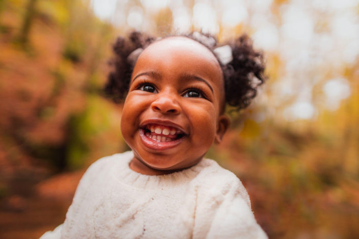 little girl smiling big