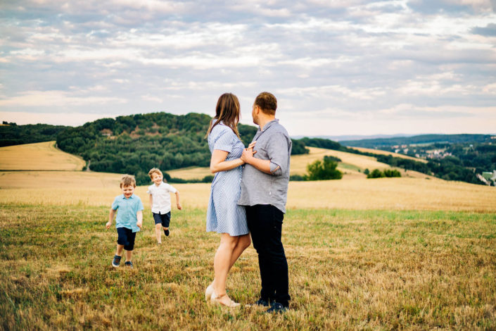 family running around in the rolling hills of Germany