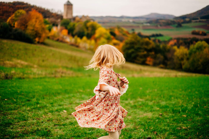 Little girl twirling in the fields of Germany