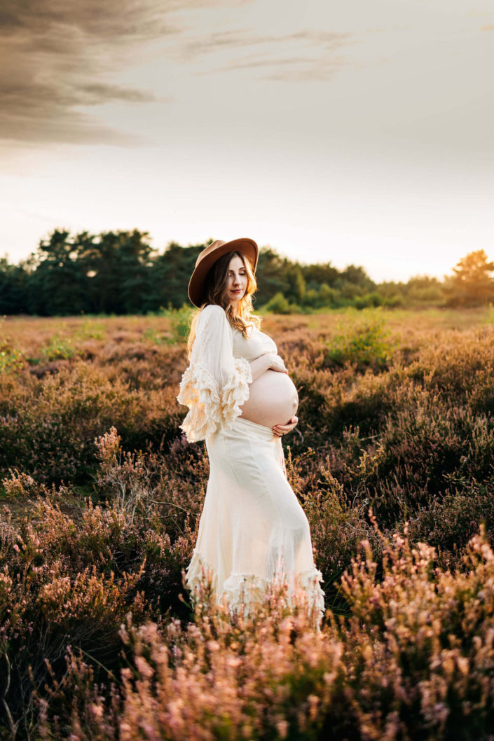 pregnant woman in a heather field